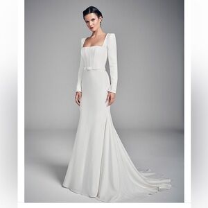 Designer white long sleeved wedding dress